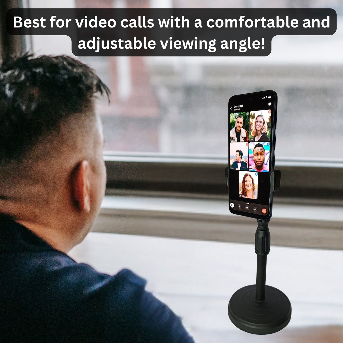 Person attending a video call with a mobile placed on the adjustable height holder