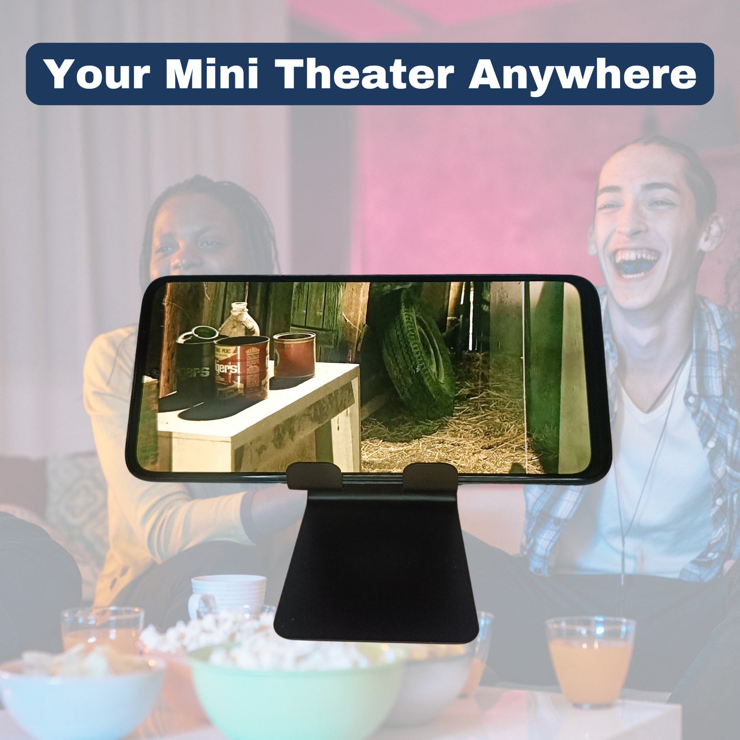 Mobile phone playing a movie on the stand while friends watch, with text "Your Mini Home Theatre"